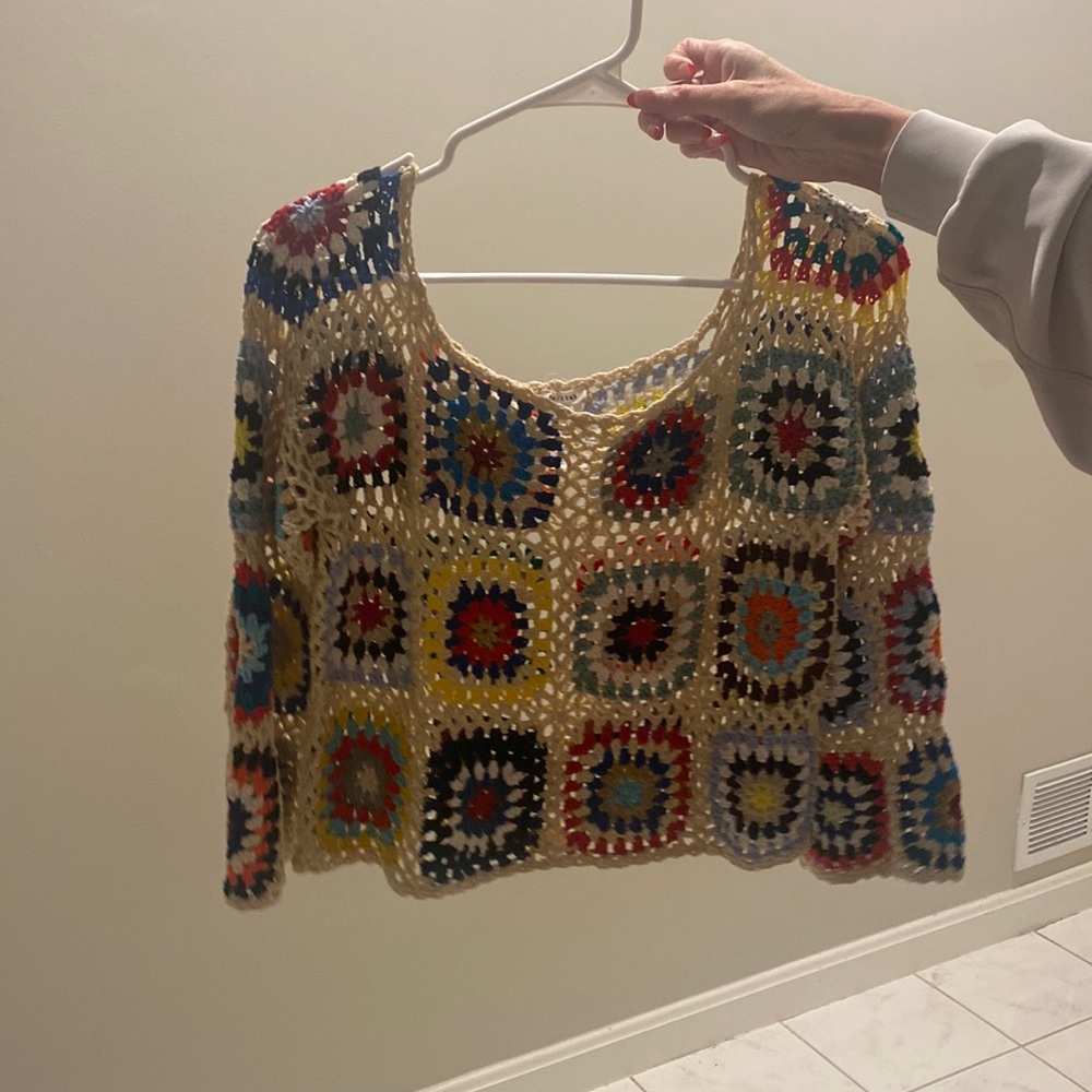 En crème sweater